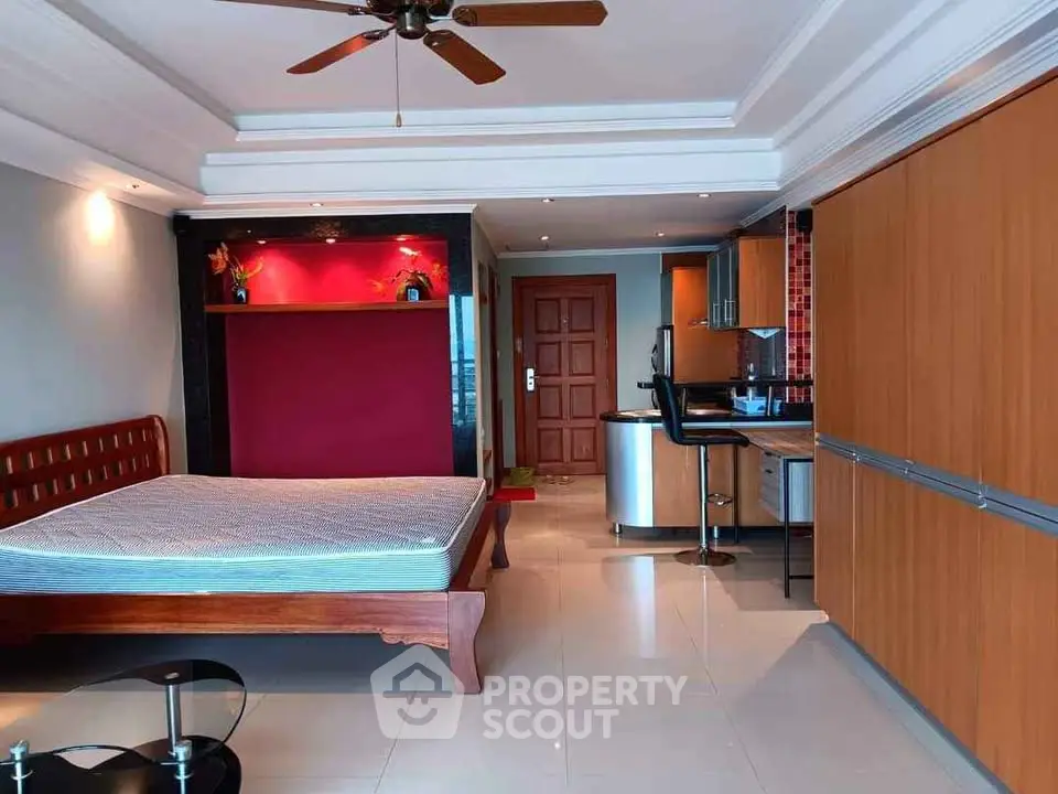Spacious studio apartment with modern kitchen and stylish decor