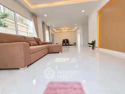 Spacious modern living room with elegant sofa and bright natural lighting