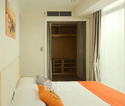 Modern bedroom with walk-in closet and stylish decor