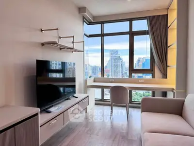 Modern living room with large window and city view, featuring sleek furniture and natural light.