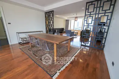 Spacious dining area with modern decor and hardwood floors in luxury apartment