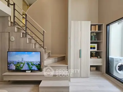 Modern duplex living room with stylish staircase and built-in storage