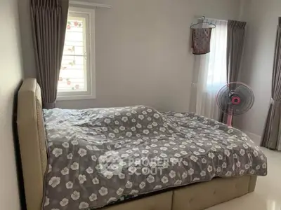 Cozy bedroom with stylish decor and natural light