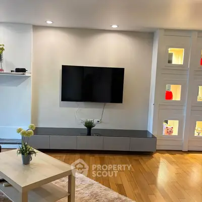 Modern living room with wall-mounted TV and stylish decor