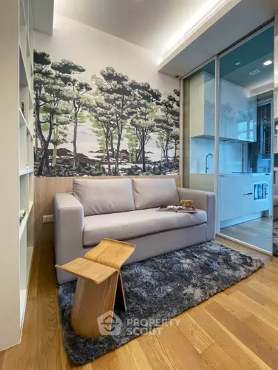 Modern living room with stylish decor and open kitchen layout in a cozy apartment.