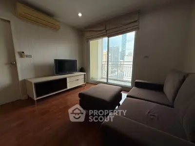 Cozy living room with modern furniture and city view balcony