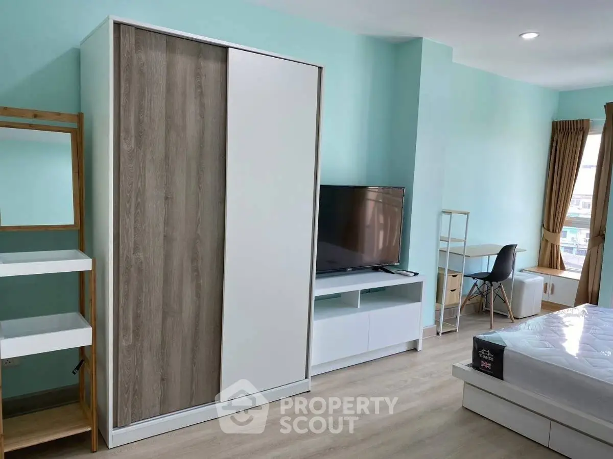 Modern bedroom with sleek furniture and natural light