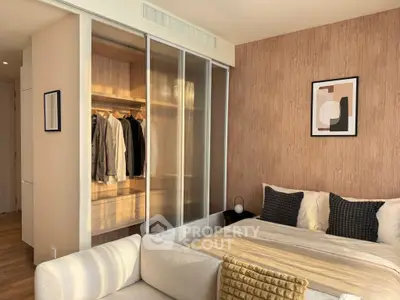 Modern bedroom with stylish decor and open closet in a cozy apartment