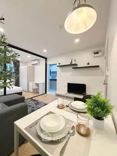 Modern open-plan living room with dining area and stylish decor