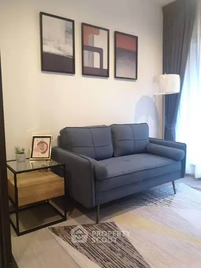 Modern living room with stylish sofa, abstract art, and elegant decor