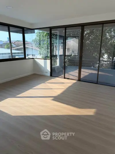 Spacious corner unit with large windows and balcony, offering abundant natural light and serene views.