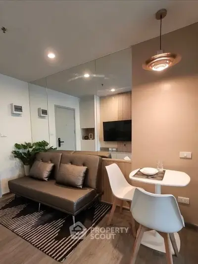 Modern living room with stylish decor and cozy seating area in a contemporary apartment.