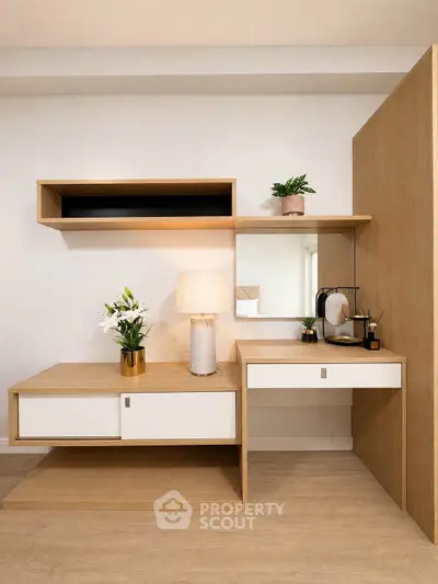 Modern study area with sleek wooden desk and shelves, featuring elegant decor and ambient lighting.
