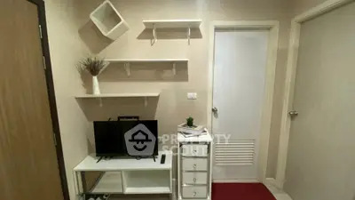 Modern living room with minimalist decor and TV stand, perfect for cozy urban living.