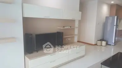 Modern living room with sleek entertainment unit and spacious layout