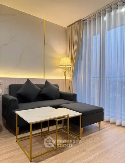 Stylish modern living room with elegant sofa and chic lighting