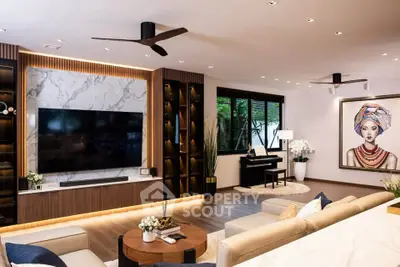 Luxurious modern living room with elegant decor and large TV, featuring stylish lighting and art piece.