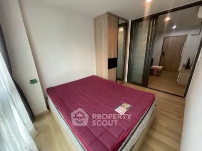 Modern bedroom with wooden flooring and stylish decor