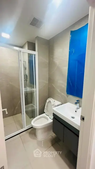 Modern bathroom with sleek shower and contemporary fixtures