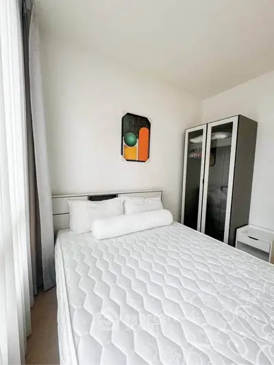 Modern bedroom with minimalist decor and ample natural light