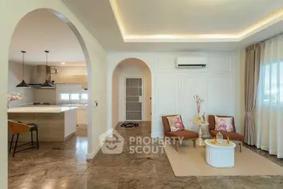 Elegant open-plan living room with modern kitchen and stylish decor