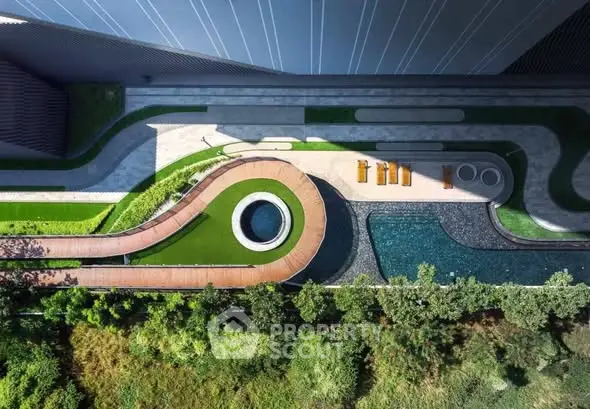 Stunning aerial view of modern landscaped garden with pool and seating area.