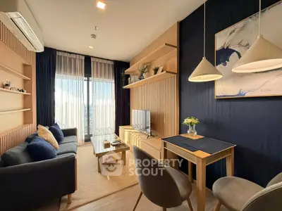 Modern living room with stylish decor, cozy seating, and natural light.