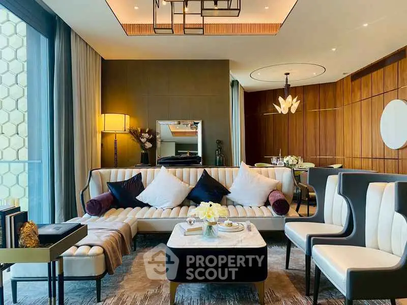 Luxurious modern living room with elegant decor and large windows