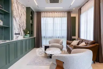 Luxurious living room with elegant marble accents and stylish furniture