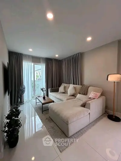 Spacious modern living room with cozy sectional sofa and elegant decor