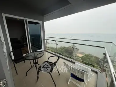 Stunning balcony with ocean view and modern seating area