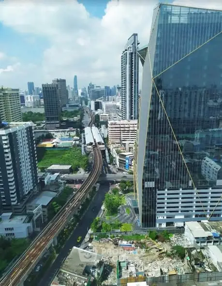 Stunning cityscape view from a high-rise building showcasing urban architecture and skyline.