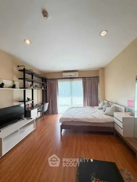 Spacious modern bedroom with elegant decor and natural light