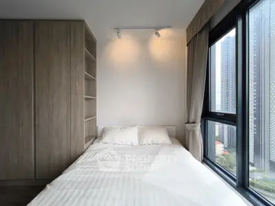 Modern bedroom with city view and built-in wardrobe