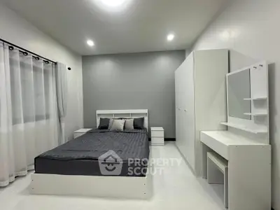 Modern minimalist bedroom with sleek furniture and neutral tones