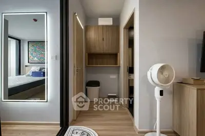 Modern apartment hallway with stylish decor and bedroom view