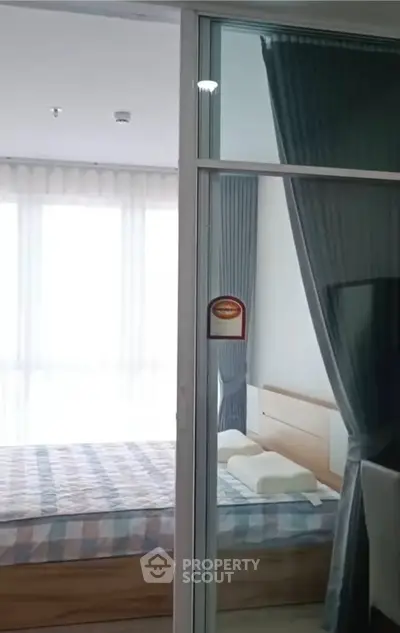 Modern bedroom with large windows and stylish curtains