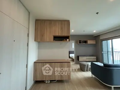 Modern apartment interior with wooden cabinets and cozy living area