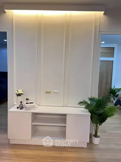 Modern interior with elegant white shelving and decorative plants