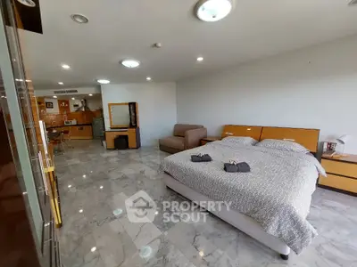 Spacious modern bedroom with open layout and marble flooring