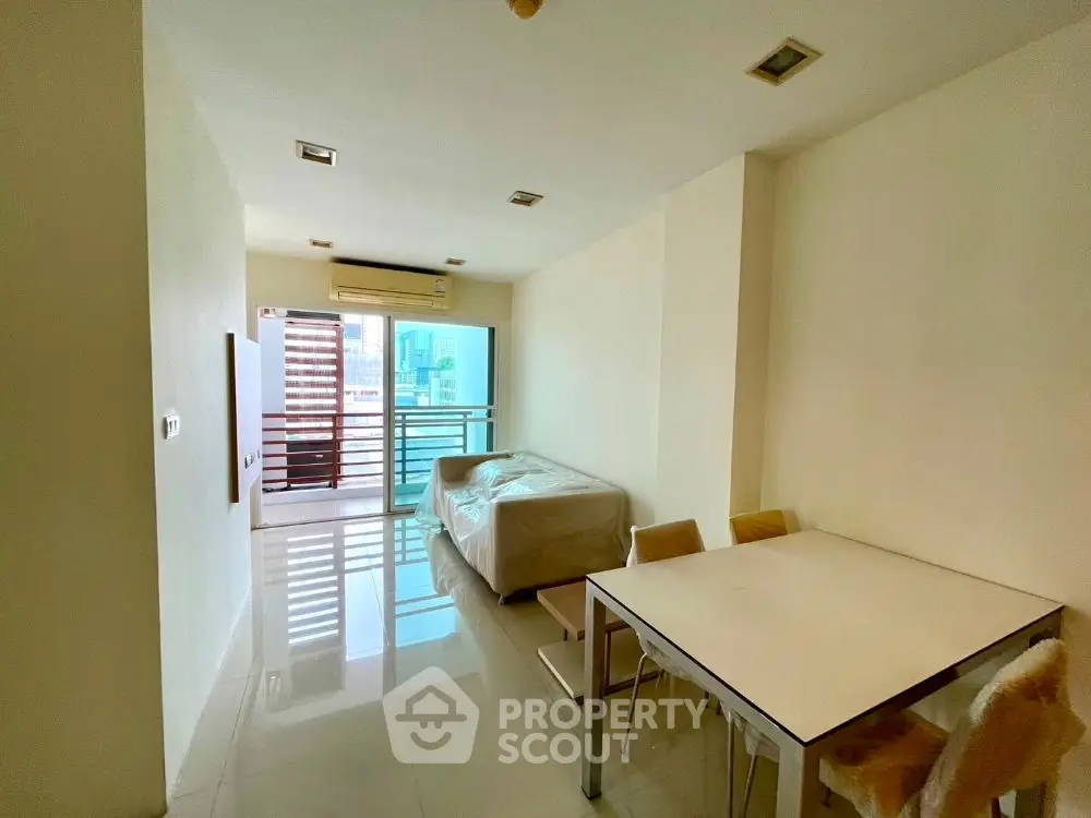 Modern living room with balcony view in urban apartment