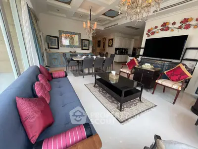 Luxurious living room with elegant decor, spacious seating, and modern dining area, perfect for entertaining.