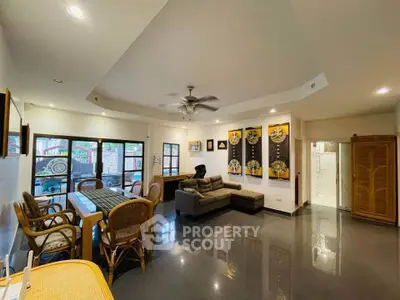 Spacious living room with modern decor and ample natural light