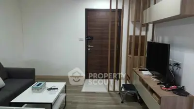Modern living room with sleek furniture and wooden accents, perfect for cozy urban living.