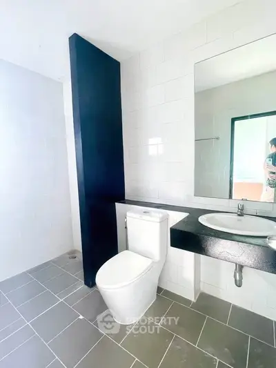 Modern bathroom with sleek design and large mirror