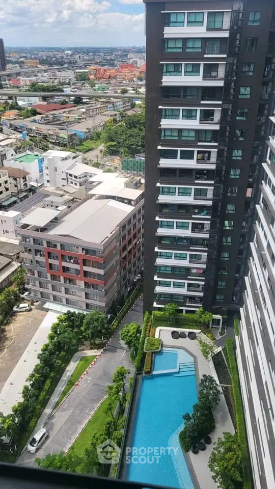 Stunning high-rise building with pool and cityscape view, perfect for urban living.