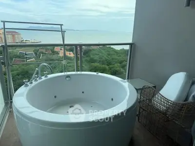 Luxurious balcony with jacuzzi offering stunning ocean views