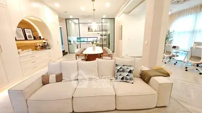 Spacious modern living room with elegant decor and open layout, perfect for family gatherings.