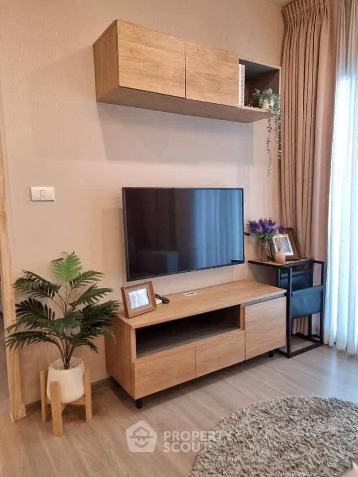 Modern living room with stylish wooden furniture and large TV