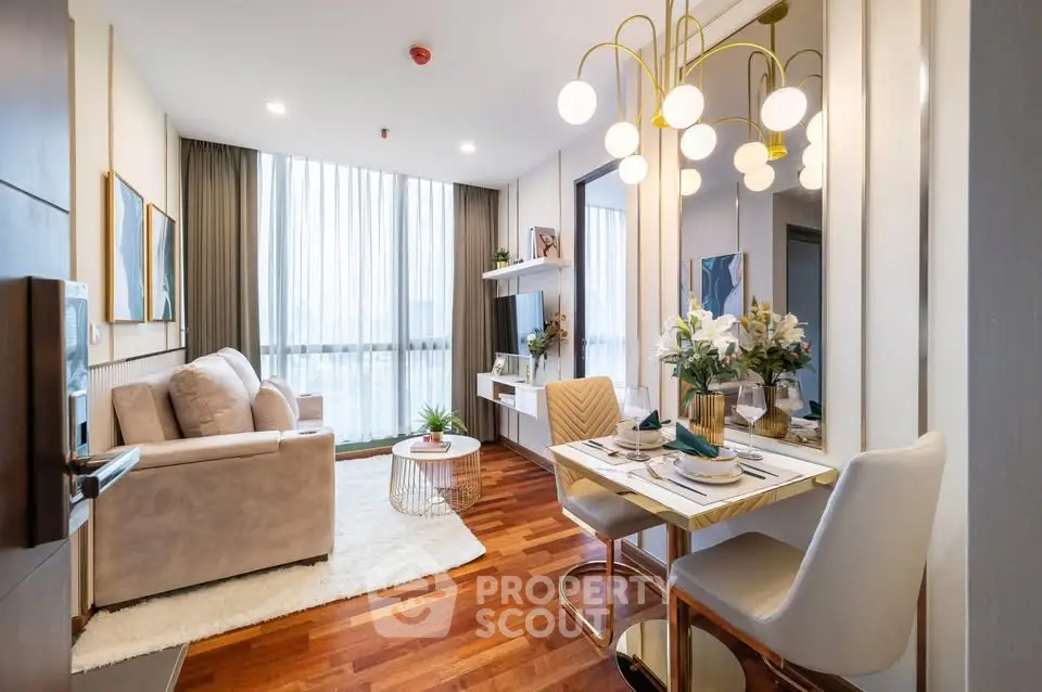Modern living room with elegant decor and large windows in a stylish apartment.